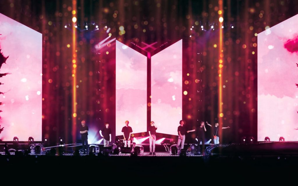 The members of BTS during their BTS Love Yourself Tour in Seoul, South Korea (Credit: Fathom Events)