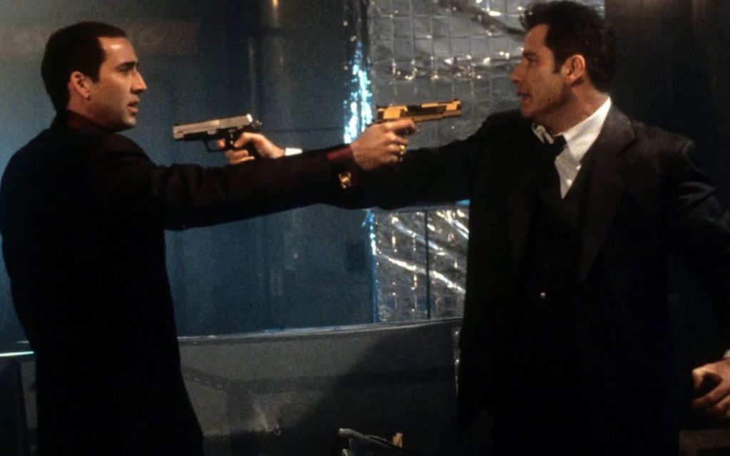 Nicolas Cage (Castor Troy) and John Travolta (Sean Archer) in Face/Off (Credit: Paramount Pictures)