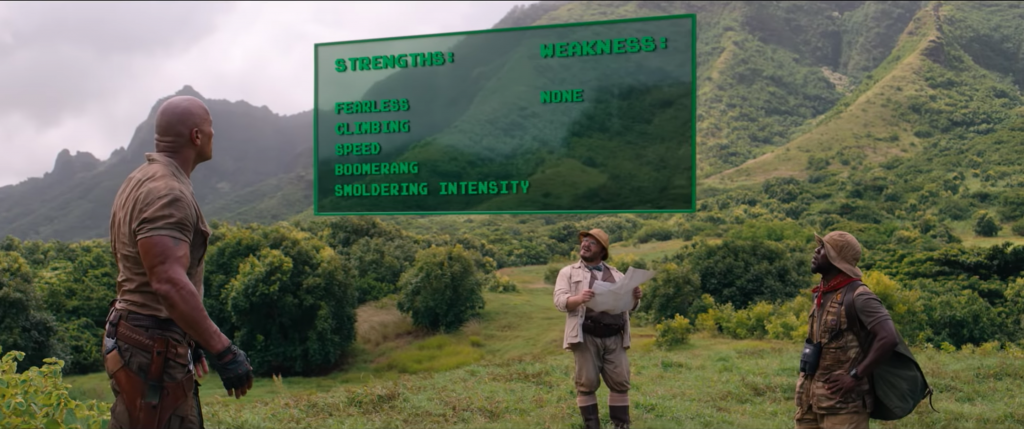 Dr. Smolder Bravestone (Dwayne Johnson), Professor Shelly Oberon (Jack Black) and Mouse Finbar (Kevin Hart) look at Spencer's new stats in 'Jumanji: Welcome to the Jungle' (Courtesy: Sony Pictures)