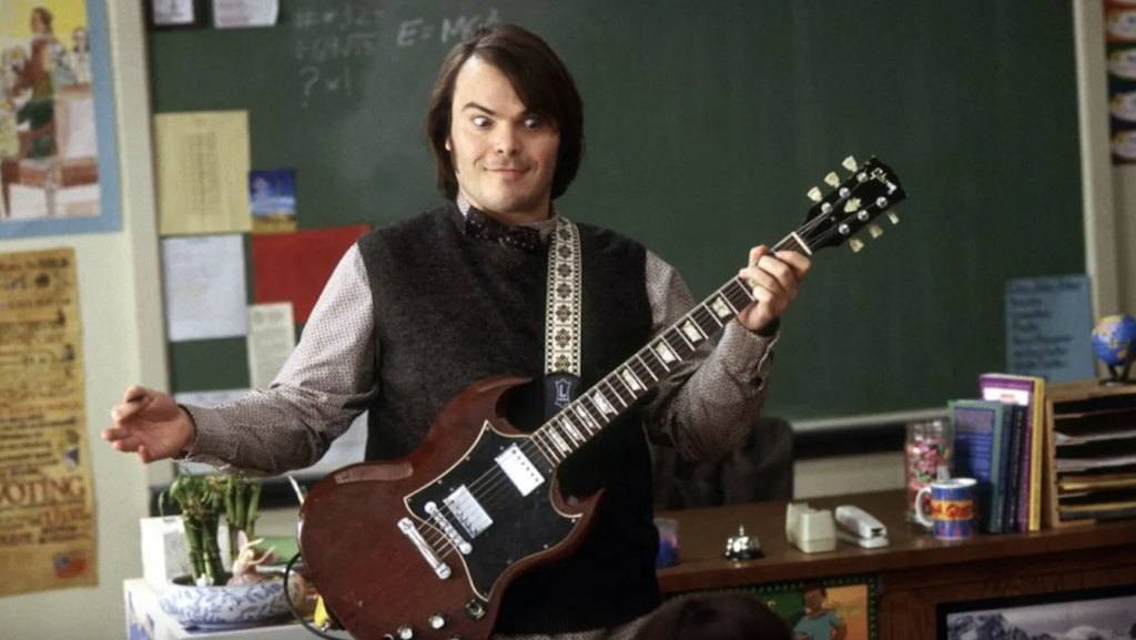 A person holding a guitar

Description automatically generated