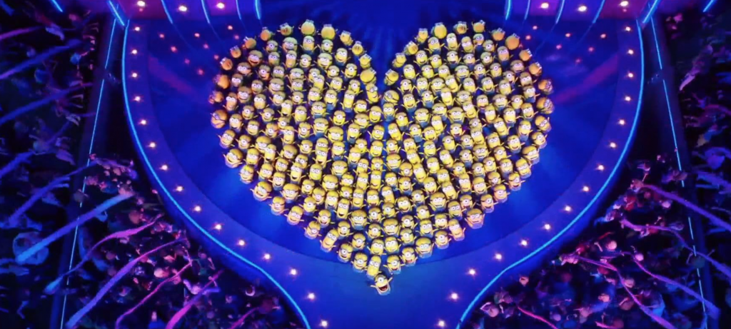 A heart shaped crowd of people

Description automatically generated